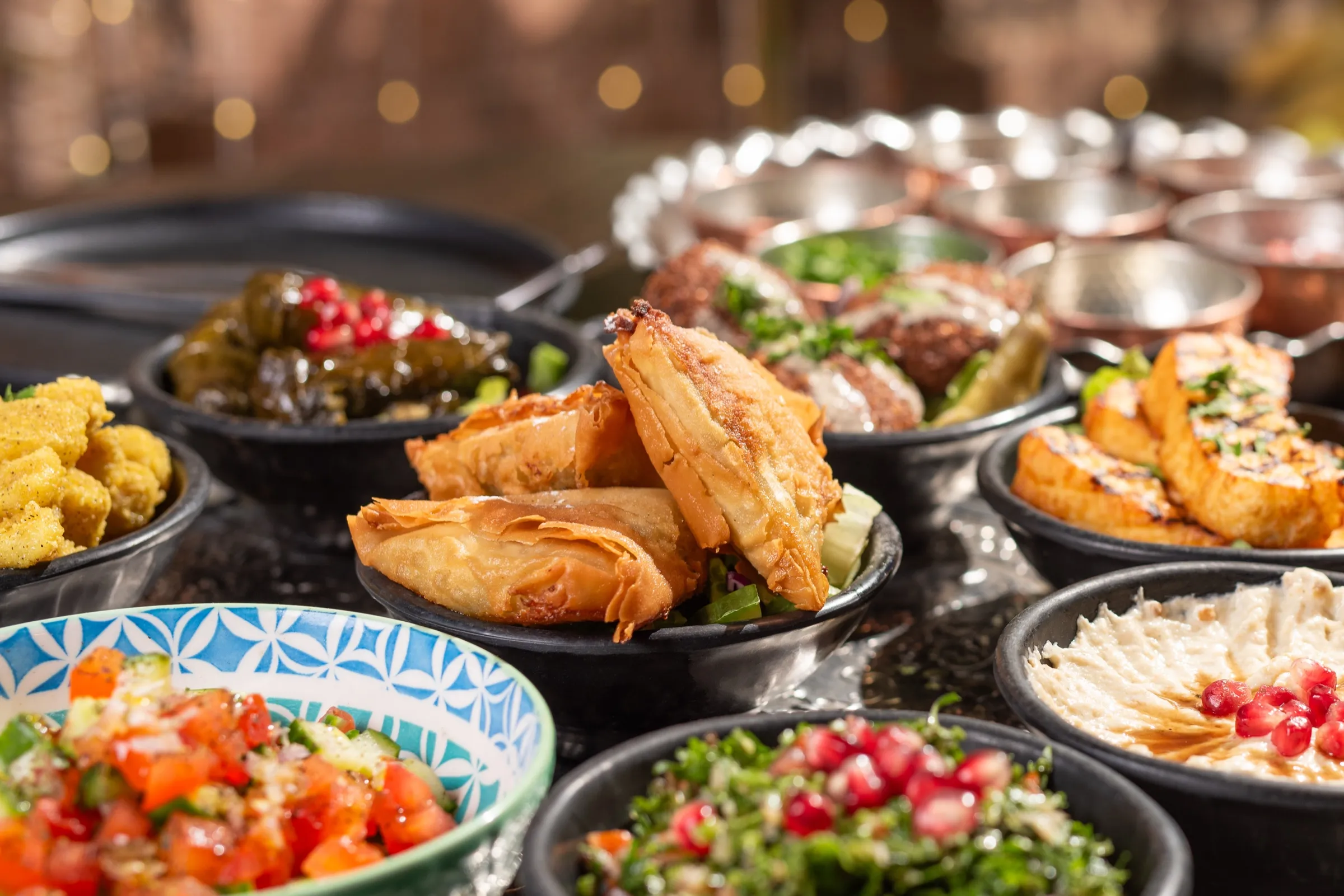 Shared mezze plate with falafel and bread